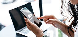 Data information concept, Young woman waiting for cloud uploading on smartphone